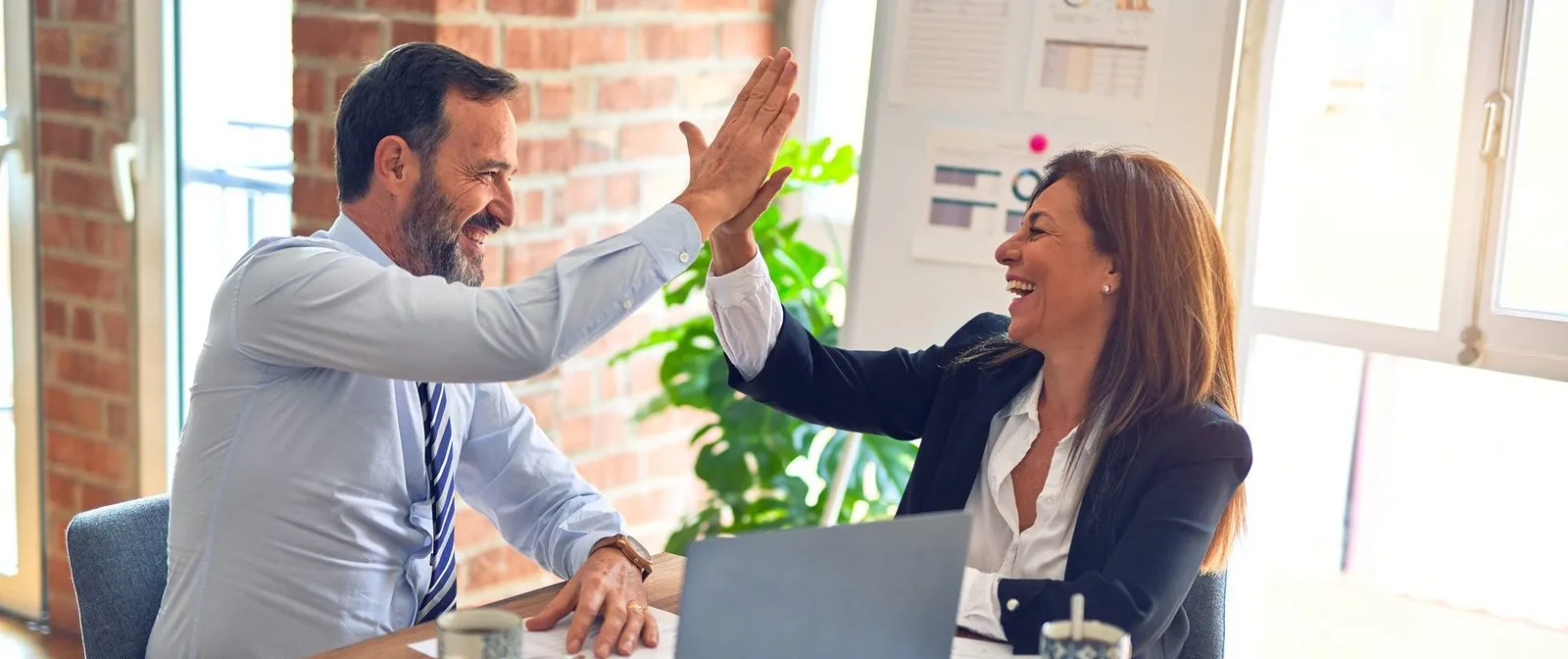 client and personal injury attorney high fiving