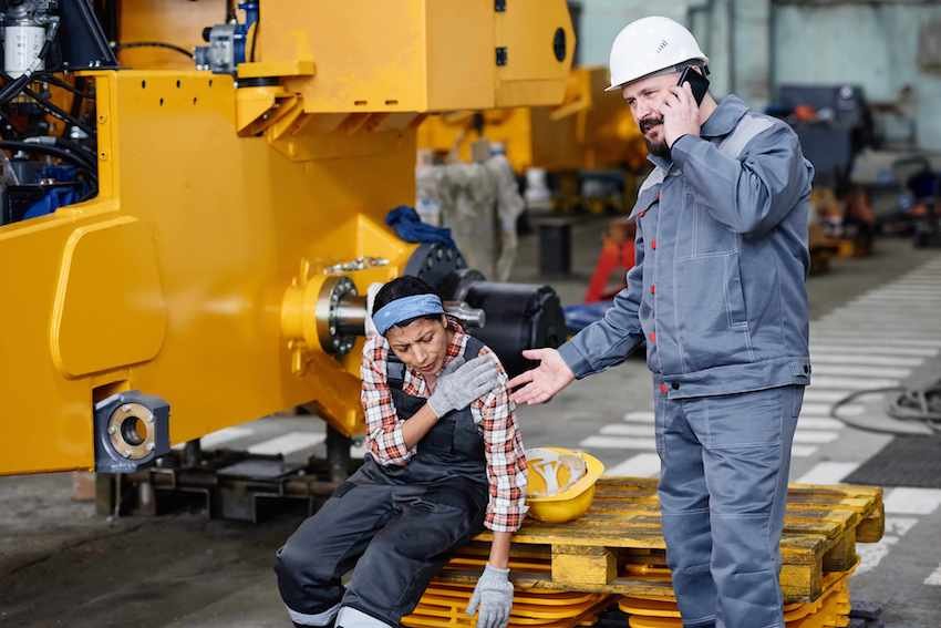mature-worker-of-warehouse-calling-workplace injury attorney