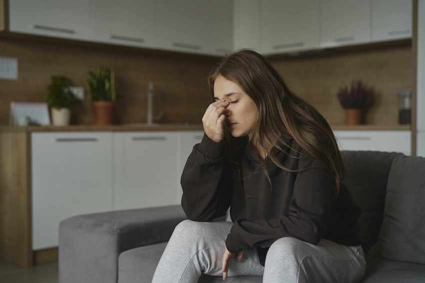 woman in pain needs lawyer to help with Calculating Damages in Personal Injury Cases