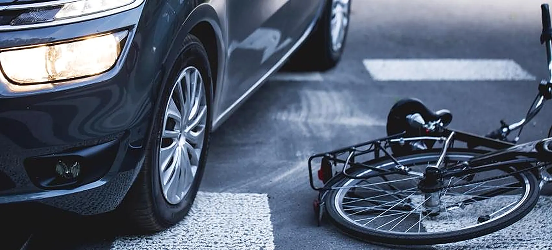 Bicycle lying on a crosswalk after an accident with a car