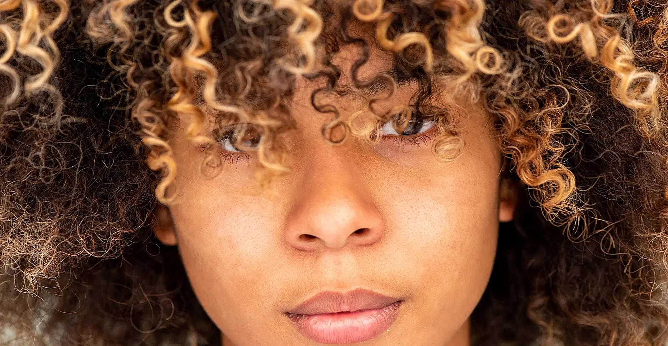 Portrait of a woman with natural curly hair
