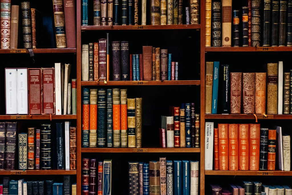 books on bookshelves representing the wealth of knowledge that will be on your side when hiring a personal injury lawyer at John B. Jackson Law