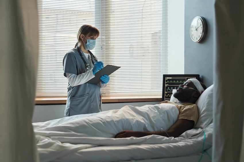 Black man on hospital bed will need to start Calculating Damages in Personal Injury Cases